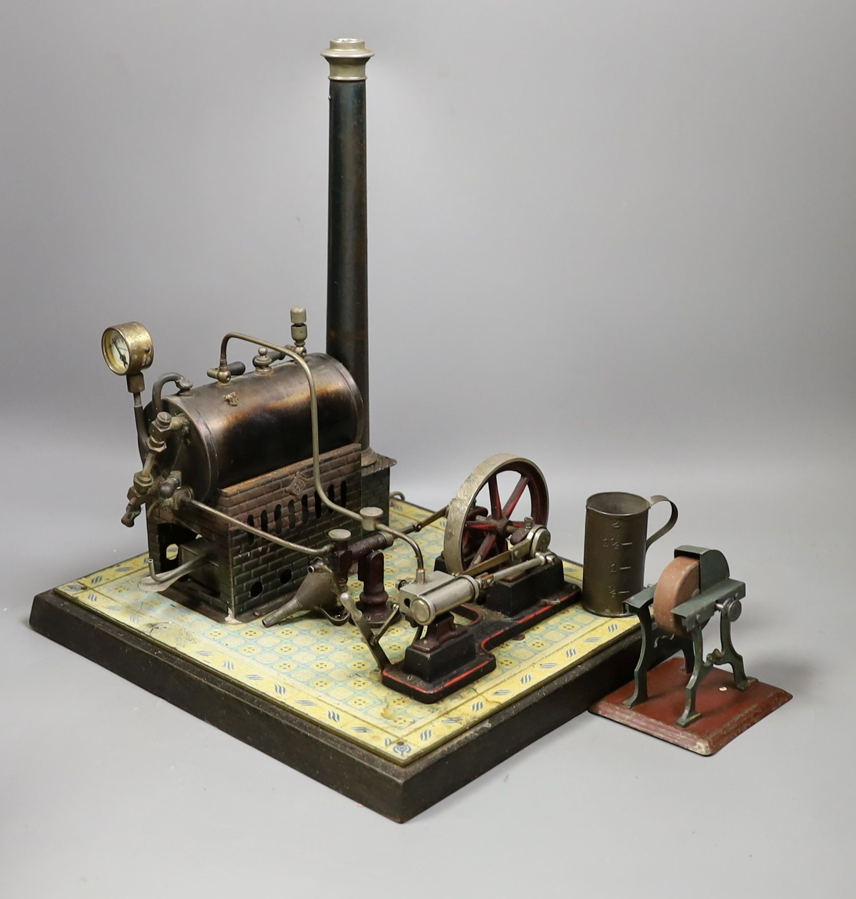 Gebruder Bing - tinplate stationary steam plant, single cylinder, rare, in original pine box, and grindstone accessories, 32cms high, width - 16cm, length - 29cm